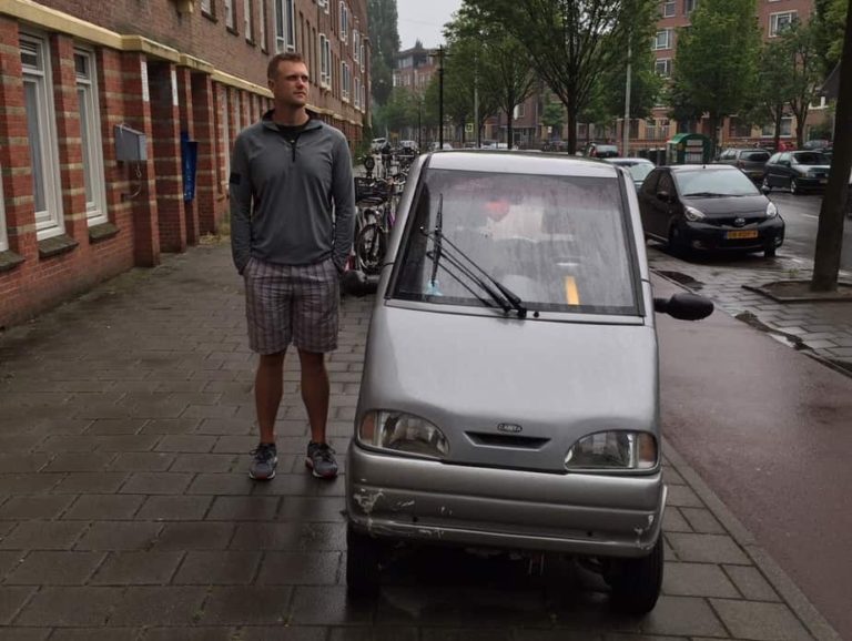 Amsterdam 1 - They drive these mini cars on the sidewalks with bikes.