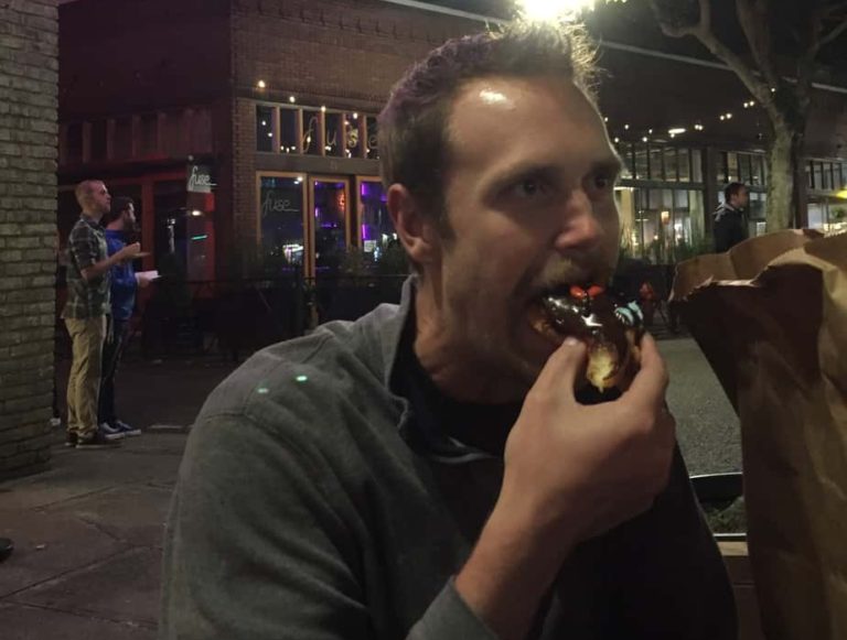 Adam enjoying a Voodoo doughnut