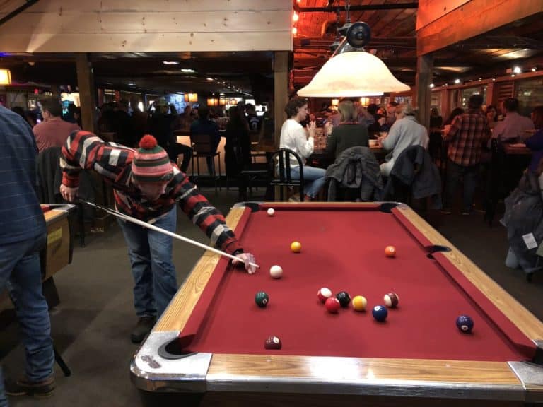 Adam repping his new Johnson Woolen Mills flannel while playing pool at Matterhorn.