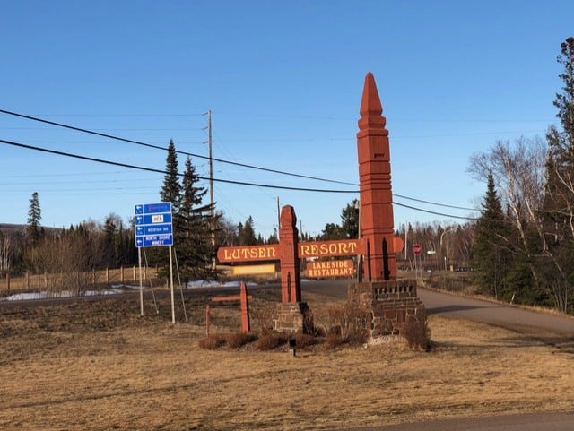 You turn by this sign to get to the main lodge where you'll find a pool and hot tub!