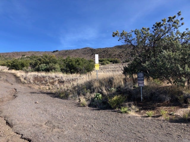 Walk up the road past the Visitor Station until you see this trail sign on the left.