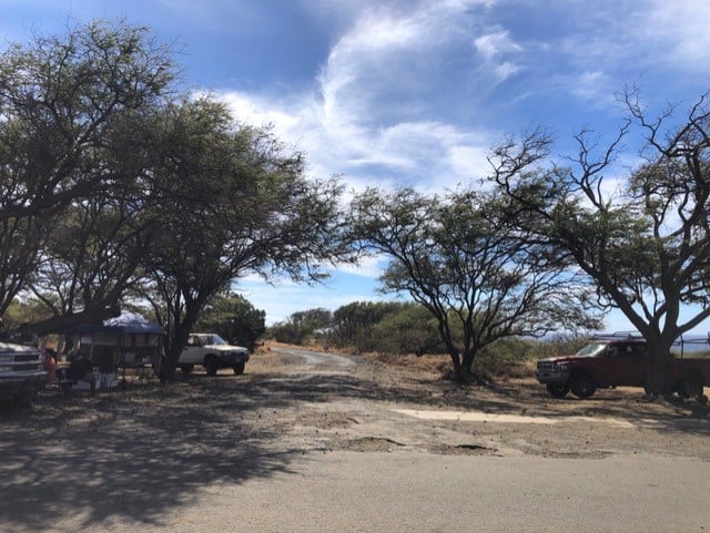 Locals waiting to drive people to Papakolea Green Sand Beach.